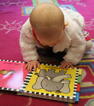 A baby with a book